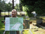 Woman holding map of British Muslim Heritage Trail