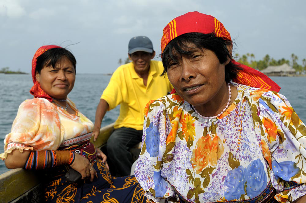 Indigenous Kuna people in a boat off Panama's San Blas islands by Jeremy Hoare.