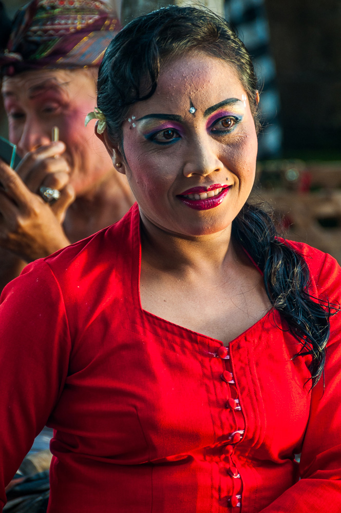 Performers preparing for a traditional Barong performance in Indonesia by Mark Andrews.