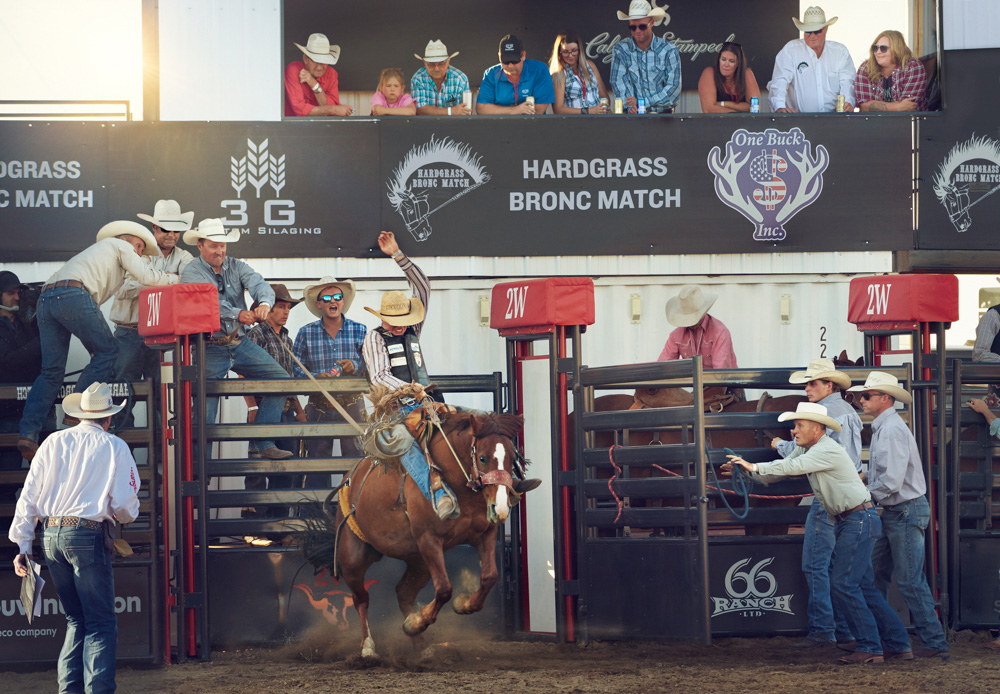 A bronc match in the Badlands of Alberta, Canada by Simon Urwin.