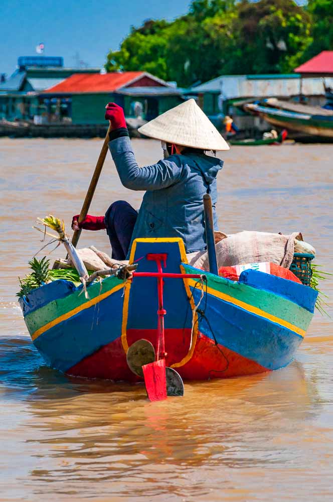 Mark Andrews photographed a woman rowing a boat at Chong Kneas, Tonle Sap Lake, Cambodia