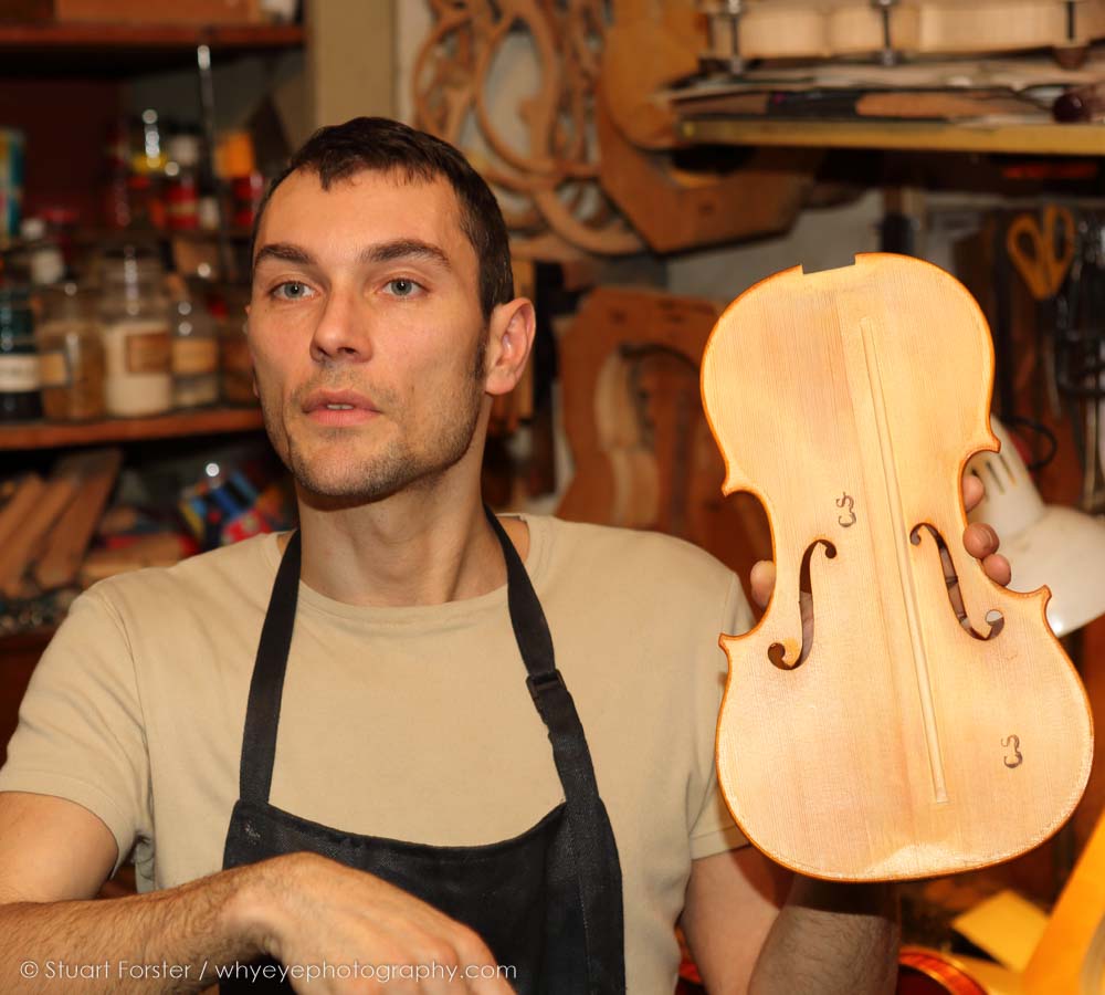 A violin maker in Cremona explains his craft during a familiarisation trip after the 2015 AGM in Milan, Italy