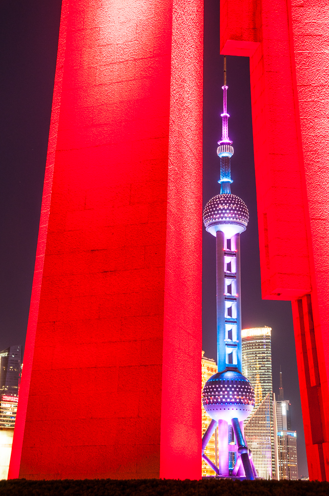 Shanghai’s Oriental Pearl Tower, seen through the gap in Huangpu Park’s Monument to the People’s Heroes, by Mark Andrews