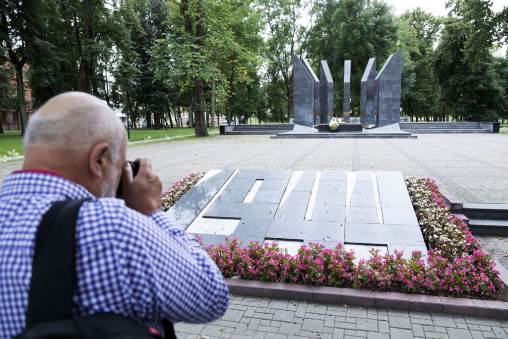 Geoff Moore photographs a war memorial in Daugavpils during the Guild press trip to Latvia