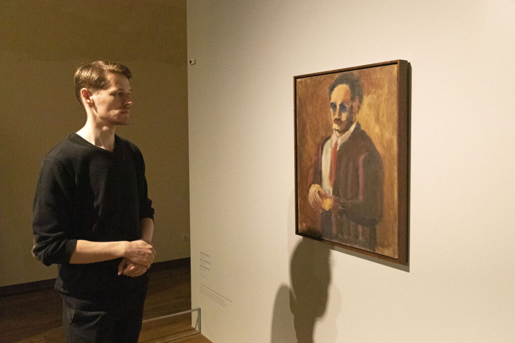 A man looks at a self-portrait of artist Mark Rothko displayed at the Mark Rothko Art Centre in Daugavpils.