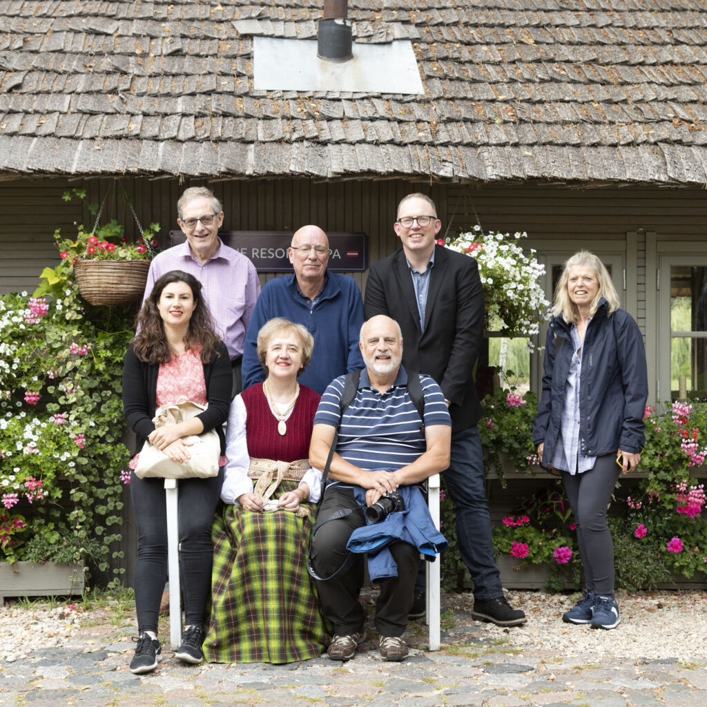 Members of the British Guild of Travel Writers with a woman in traditional Latgalian costume at Silene Resort and Spa near Daugavpils.