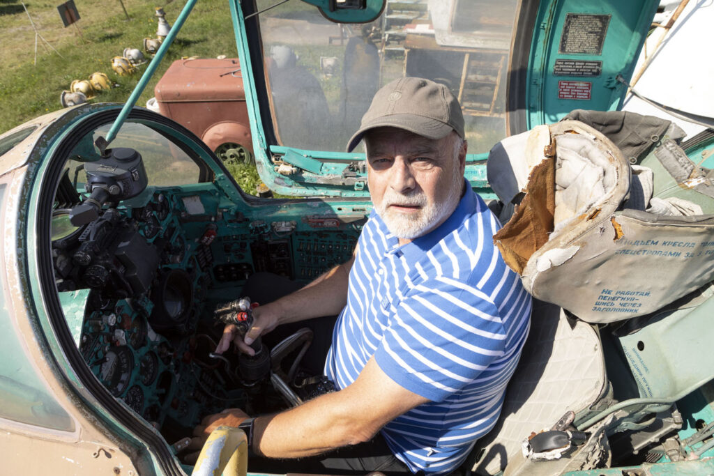 Guild member Geoff Moore in the cockpit of a MiG fighter jet in Riga