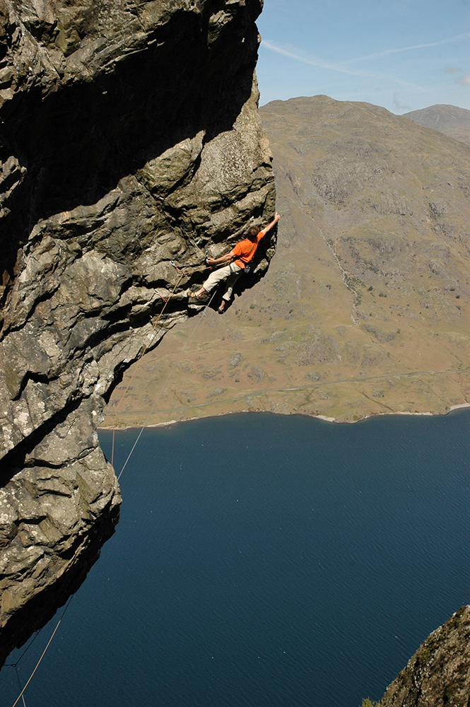 Dave Birkett making the first ascent of a route called 'Nowt But A Fleein Thing' on Cam Crag, Wasdale by Bill Birkett